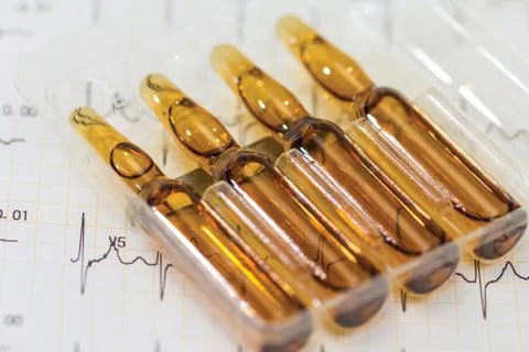 Ampoule, Phials on cardiogram background Stock Photos