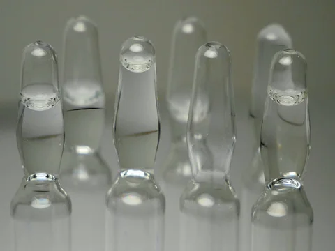 Ampoules with a clear solution for injection. panning close-up Видео 84853073