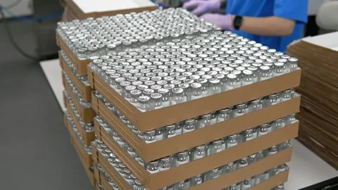 Ampoules with medicine vaccine in boxes. Stock Footage