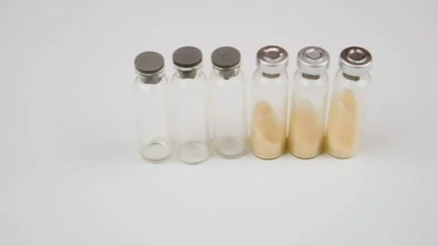 Ampule with white powder, illegal pharmacy production, drugs. Glass medical ampo Stock Footage 277352607