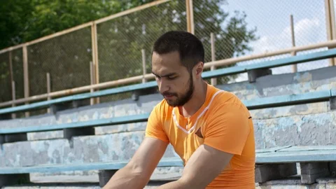 Amputee Athlete Donning a Shrinker Sock Stock Footage 99767968