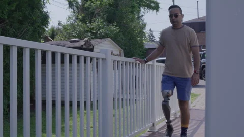 Amputee walking up a ramp Stock Footage 288234041