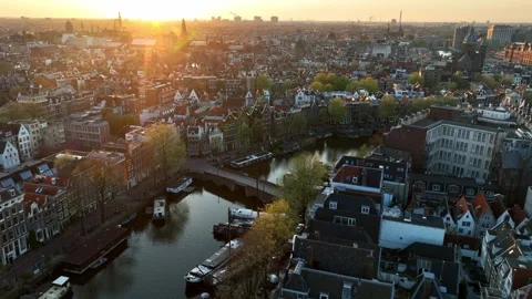 Amsterdam aerial view at sunset, drone shot of the capital of the Netherlands in Stock Footage 310831781