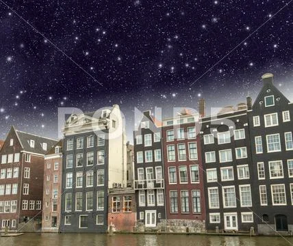 Amsterdam. beautiful view of classic buildings with night sky Stock Photos