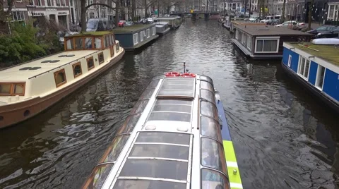 Amsterdam Boat Floating Down Canal Video stock 66299919
