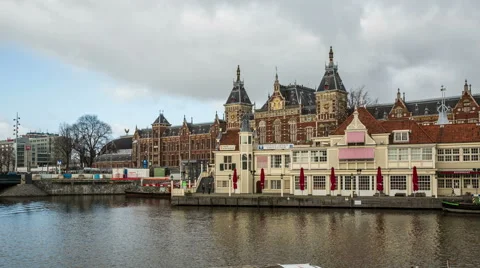 Amsterdam central station building width cloudy sky DSLR hyperlapse Stock Footage 48609644