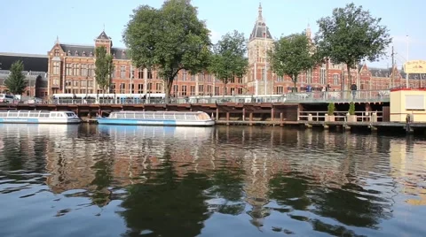 Amsterdam central train station and water reflection Stock Footage 46155584