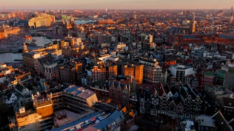 Amsterdam City Centre at Sunset 4K Drone Shot Warm Golden Hour Urban Landscape Video stock 334273785