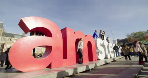 Amsterdam landmark, tourists posing logo city Stock Footage 56564313