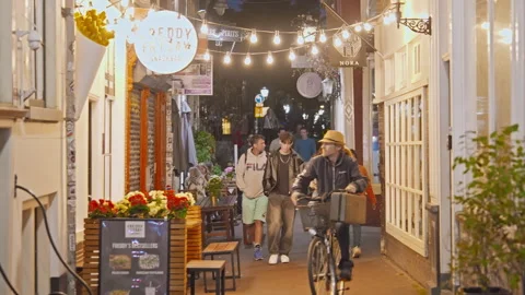 Amsterdam, Netherlands - 20.08.2025: Night view of Amsterdam. People walking Stock Footage 320844153