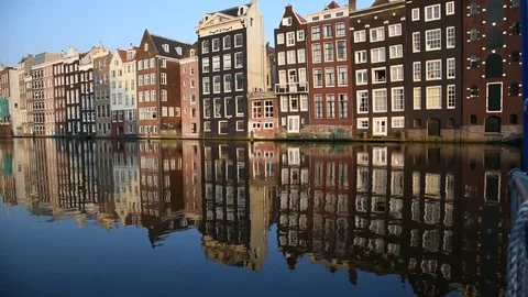 Amsterdam, Netherlands - Old building reflection in famous Amsterdam canal Stock Footage 73652068