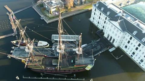 Amsterdam, Netherlands Old Ship, River Boats, Canal, Bridge. Drone City flight Stock Footage 227061631