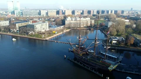 Amsterdam, Netherlands Old Ship, River Boats, Canal, Bridge. Drone City flight Stock Footage 227061918