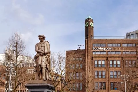 Amsterdam, Netherlands statue of Rembrandt and Booking.com Stock Photos