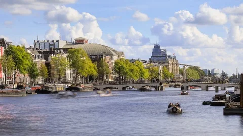 Amsterdam panoramic view of the boats floating on chanel near Magere Brug Stock Footage 102081124