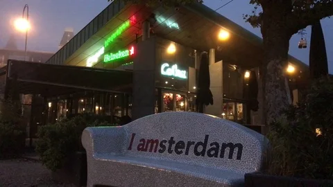 Amsterdam Pub with Sign on Bench Stock Footage 84463770