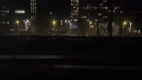 Amsterdam station NS train drive track view night outside moving sprinter Stock Footage 220622494