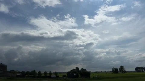 Amsterdan Forest, serene cloudscape over open field with trees in the distance Stock Footage 342752457