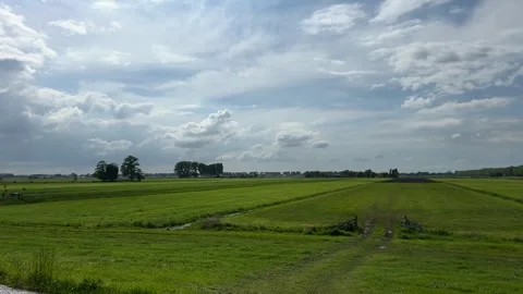 Amsterdan Forest, serene open field with water body and sky, aerial view of Stock-Footage 342752299