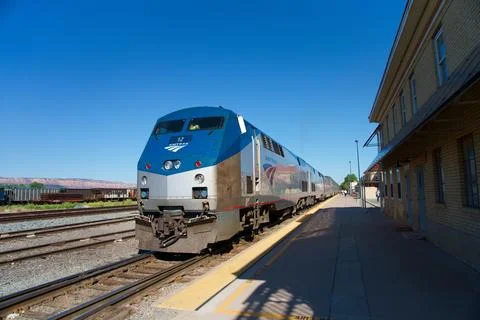 Amtrak stops at a station Stock Photos