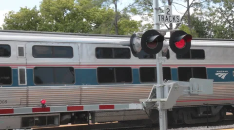 Amtrak Train Blocks Road and Crossing Lights Blink Stock Footage 37253750