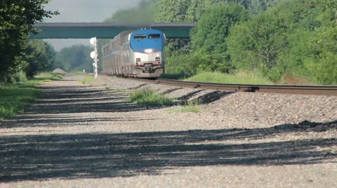 Amtrak train going down tracks no logos. Stock Footage 1076815