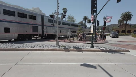Amtrak Train Passing Through Railway Crossing at Santa Barbara Station Stock Footage 307237833