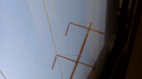 AmtrakTrain overhead power lines, dutch angle, cu pov Stock Footage 50664487