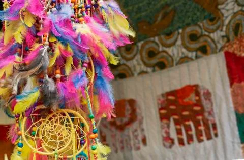 Amulet Dream Catcher of multicolored feathers. Stock Photos