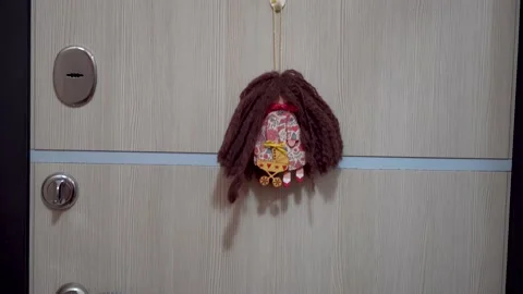 Amulet hanging on the door Stock Footage 153780975