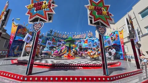 Amusement park break dance ride spinning at a funfair Stock Footage 337954859