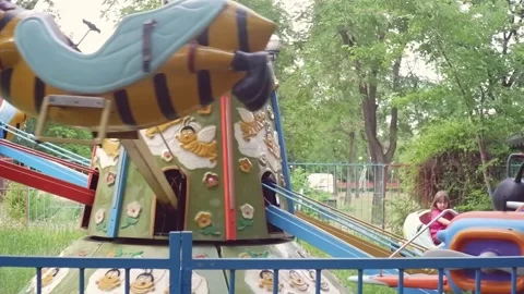 Amusement park carousel with bees and planes 스톡 동영상 340131019