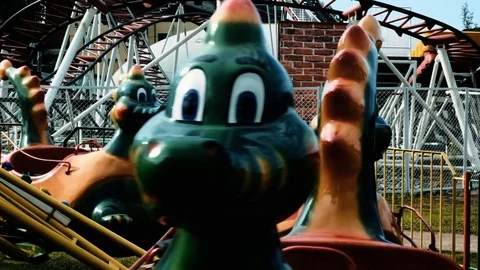 Amusement park dragons carousel sequence Stock Footage 113068454