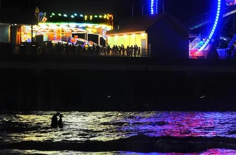 Amusement park on a pier Stock Photos