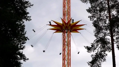 Amusement park ride against cloudy sky Stock Footage 114057585