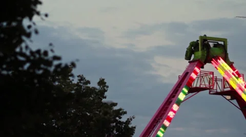 Amusement Park Ride Behind Tree Stock Footage 28997091