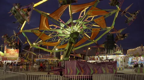 Amusement park ride on a cloudy early evening. 4K UHD. Stock-Footage 54292560