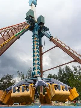 Amusement park ride with spinning seats and metal supports Stock Photos