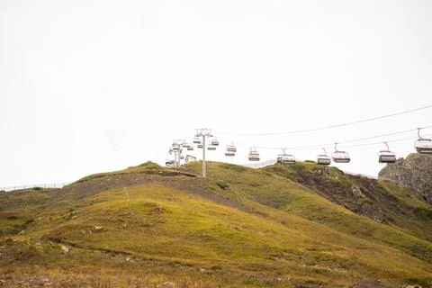 Amusement park rides, excursion with ski lift in the fog. Natural park Stock Photos