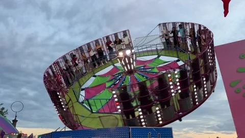 Amusement park, roller coaster and ferris wheel at sunset, in Dartmouth, Canada Stock Footage 255237792