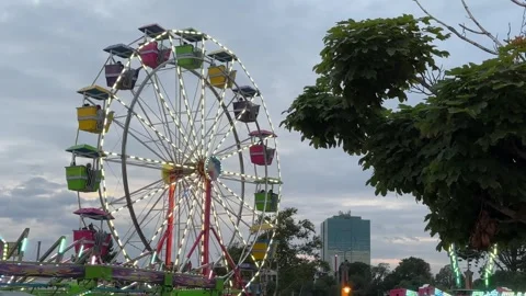 Amusement park, roller coaster and ferris wheel at sunset, in Dartmouth, Canada Vídeo Stock 255237959