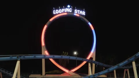 Amusement park static night shot of a roller coaster ride loop with Stock Footage 228708088