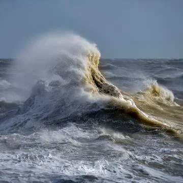 Amzing image of individual wave breaking and cresting during violent windy st Stock Photos