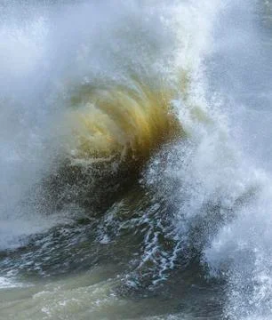 Amzing image of individual wave breaking and cresting during violent windy st Stock Photos