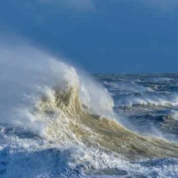 Amzing image of individual wave breaking and cresting during violent windy st 스톡 사진