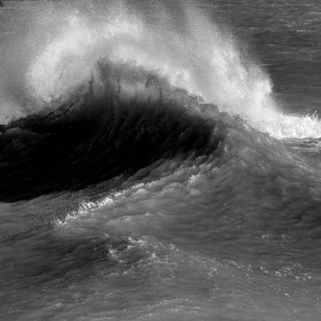 Amzing image of individual wave breaking and cresting during violent windy st Stock Photos