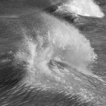 Amzing image of individual wave breaking and cresting during violent windy st 스톡 사진