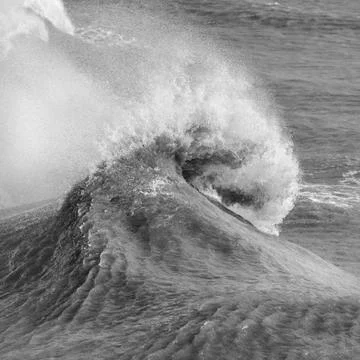 Amzing image of individual wave breaking and cresting during violent windy st Stock Photos