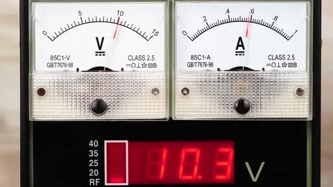 Analog and digital DC voltmeter and ammeter dial Stock Footage 198319621