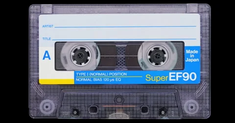 Analog audio cassette on black background Stock Footage 345257581